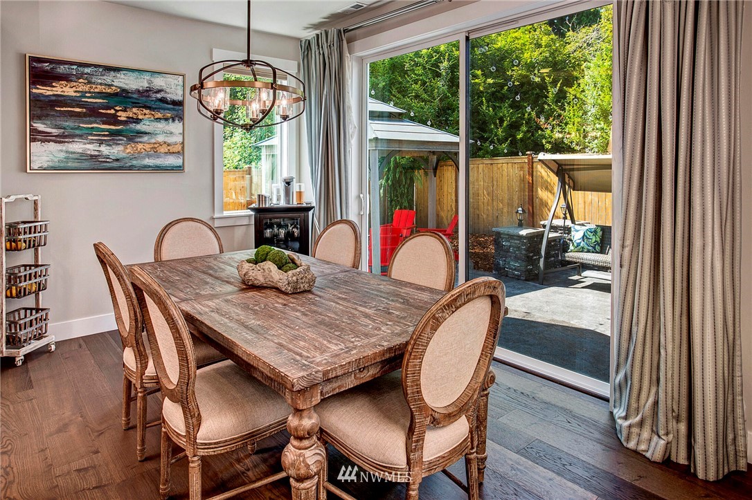 22326 9th Drive Southeast Bothell, WA 98021 - Photo 15 of 40 a dining room with furniture a chandelier and wooden floor