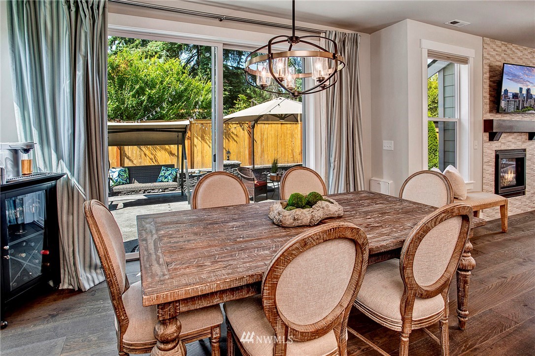 22326 9th Drive Southeast Bothell, WA 98021 - Photo 16 of 40 a dining room with furniture a chandelier and wooden floor