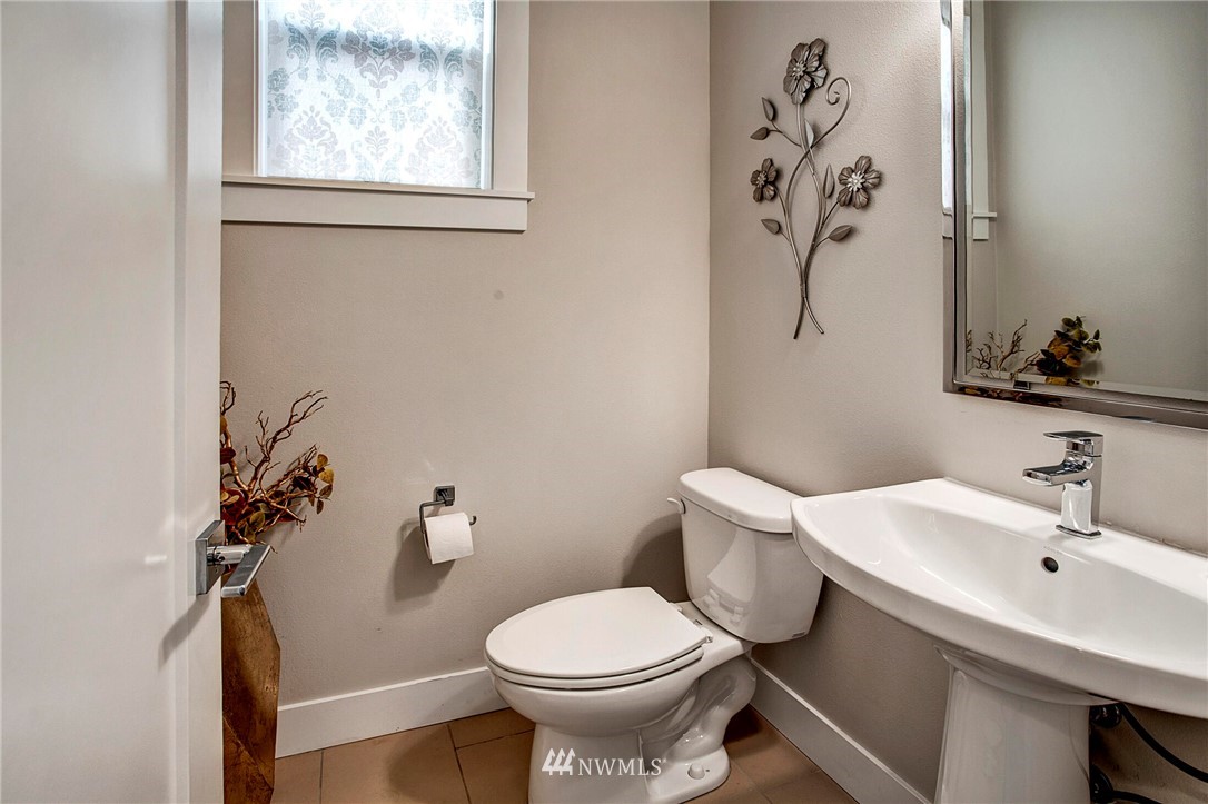 22326 9th Drive Southeast Bothell, WA 98021 - Photo 17 of 40 a bathroom with a sink a toilet and a mirror