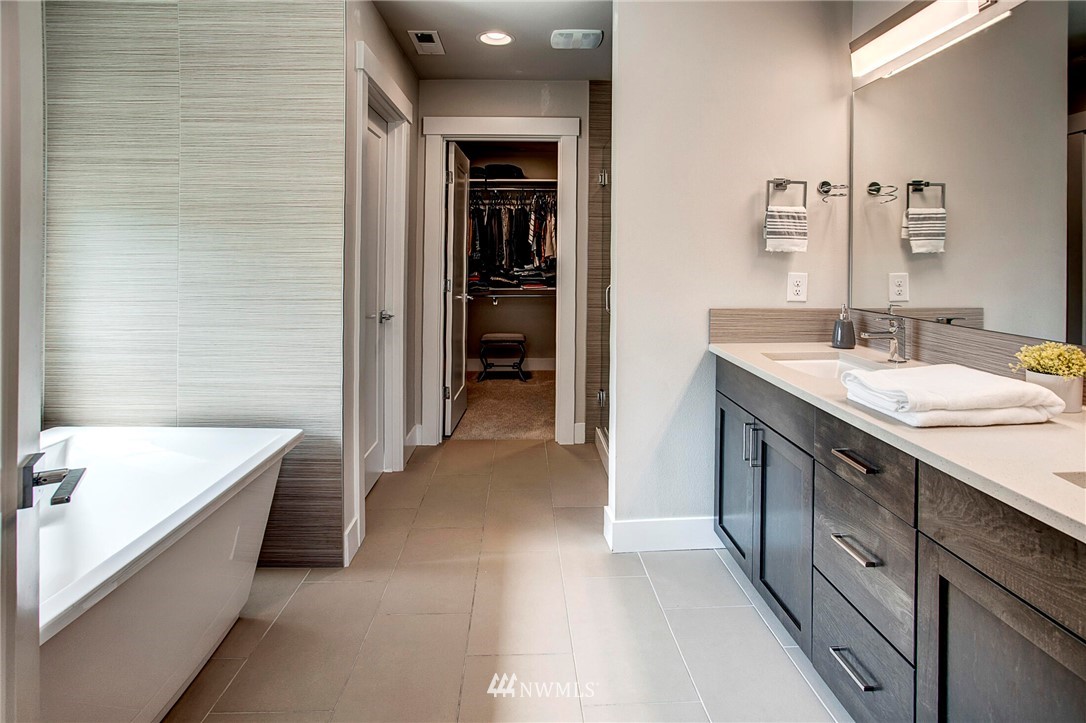 22326 9th Drive Southeast Bothell, WA 98021 - Photo 21 of 40 a bathroom with a tub sink and mirror
