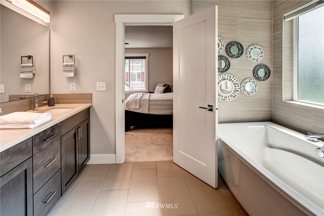 22326 9th Drive Southeast Bothell, WA 98021 - Photo 22 of 40 a spacious bathroom with a tub sink and mirror