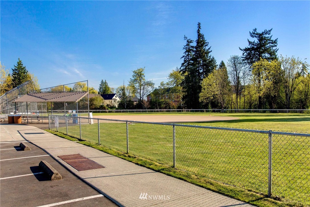 22326 9th Drive Southeast Bothell, WA 98021 - Photo 39 of 40 a view of a swimming pool with a lawn chairs under an umbrella