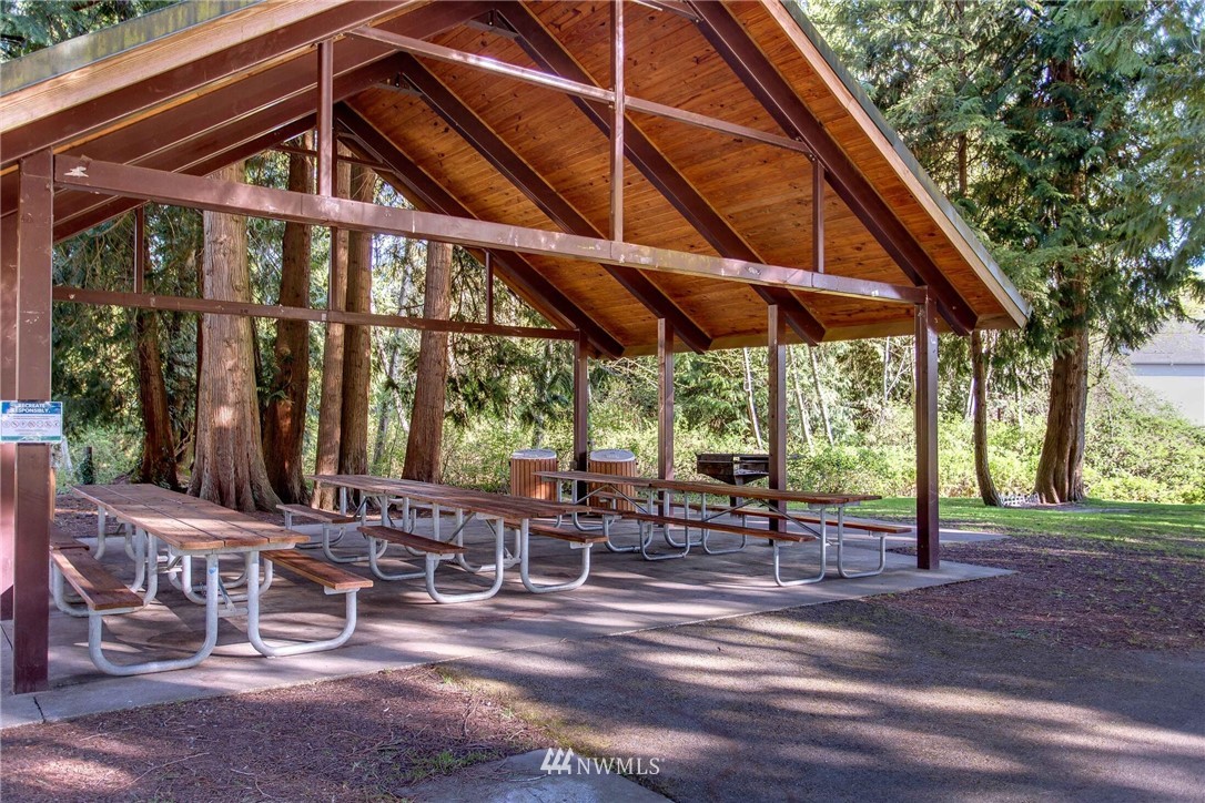 22326 9th Drive Southeast Bothell, WA 98021 - Photo 40 of 40 a view of a patio with a table and chairs under an umbrella