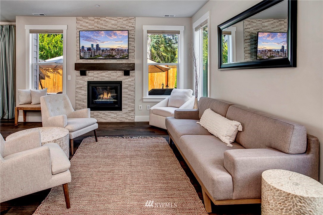 22326 9th Drive Southeast Bothell, WA 98021 - Photo 5 of 40 a living room with furniture a flat screen tv and a fireplace