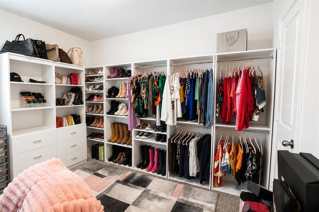 3204 Quiet Valley Road Fort Worth, TX 76123 - Photo 4 of 29 a view of walk in closet with clothes and shoes