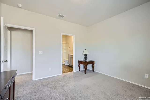 a view of room with table and chair