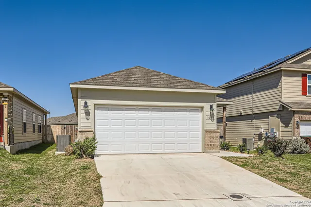 a front view of a house with a garage