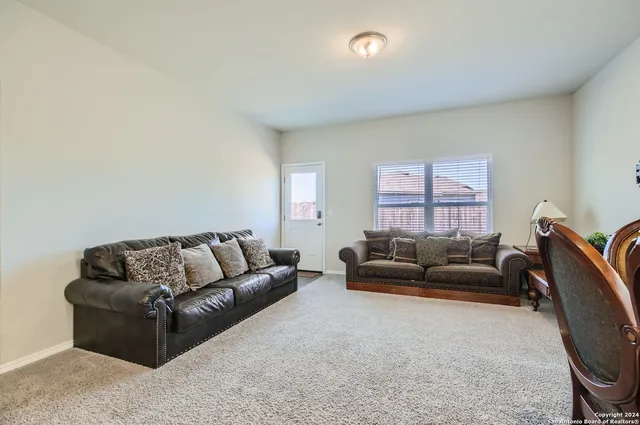 a living room with furniture and a couch