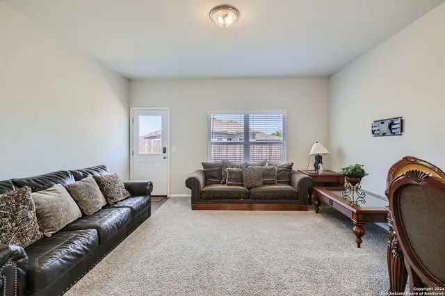 a living room with furniture and a couch