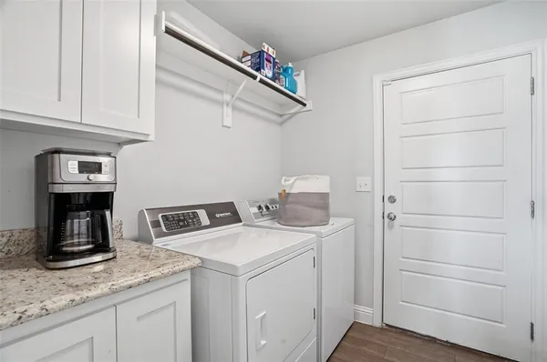 a utility room with dryer and washer