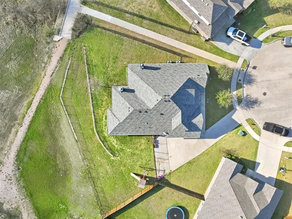 an aerial view of a house with a garden
