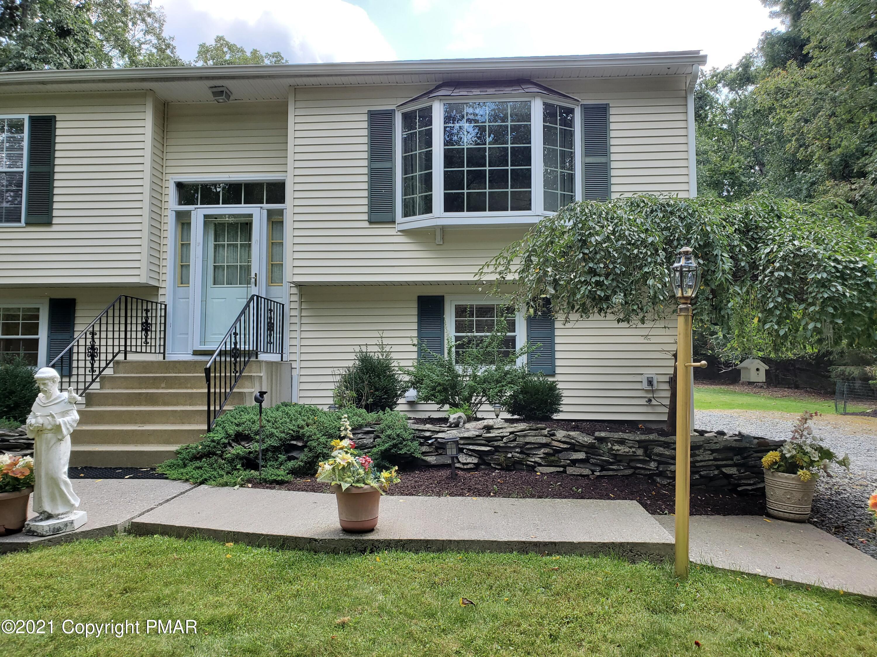 284 Powder Horn Road Henryville, PA 18332 - Photo 5 of 42 a view of a house with backyard and garden