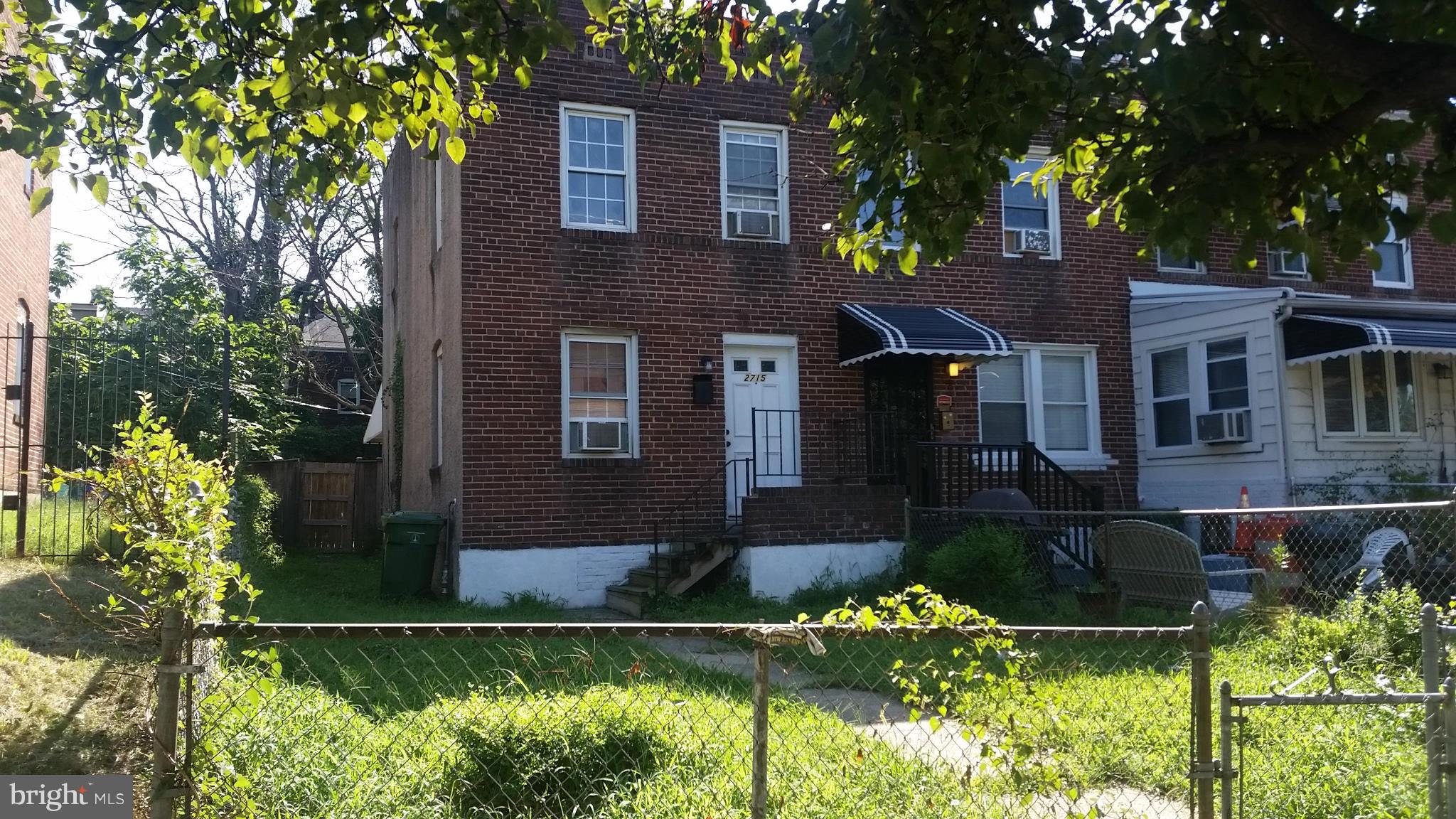 2715 Round Road Baltimore, MD 21225 - Photo 1 of 1 front view of a house with a garden