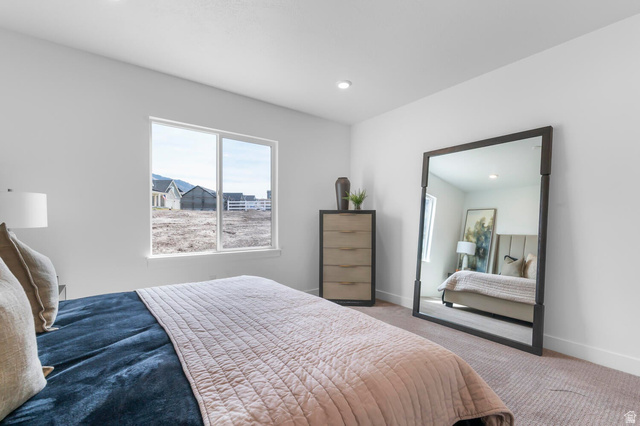 342 North Rhyolite Drive, Unit 88 Hurricane, UT 84737 - Photo 13 of 26 Spacious room with light-colored carpeting and a large window providing ample natural light