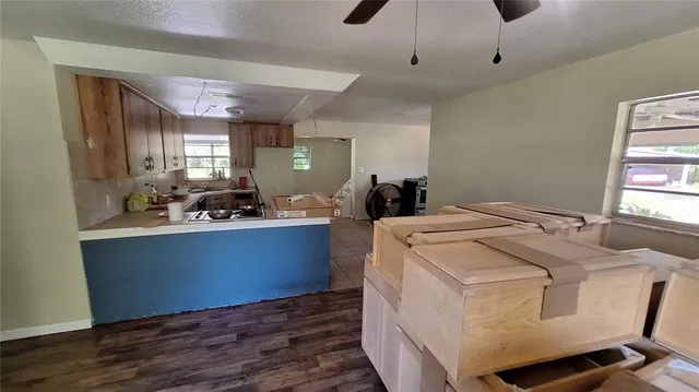 a room with a bed and wooden floor