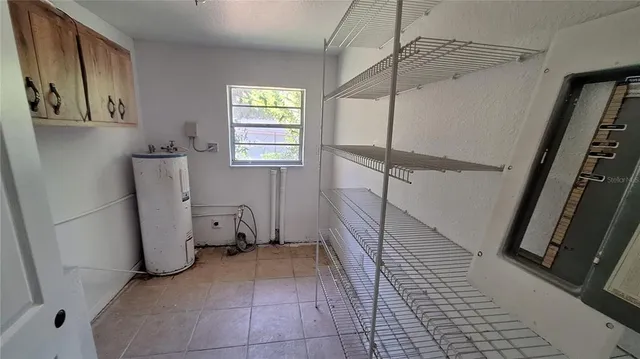 a view of a storage & utility room with two washing machine
