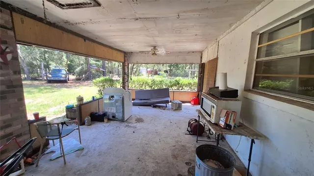 a view of a room with workspace and windows