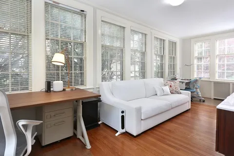 a living room with furniture and windows
