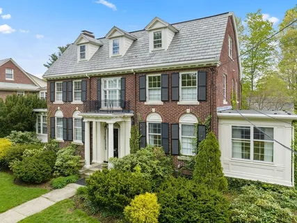 front view of a house with a garden