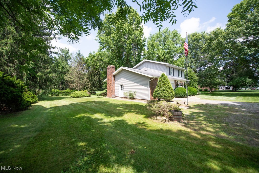 3949 Bair Road Northwest Dover, OH 44622 - Photo 5 of 48 Side view of home with yard area