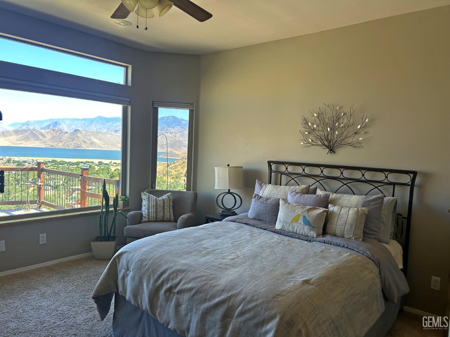 Undisclosed Address Lake Isabella, CA 93240 - Photo 17 of 40 a bedroom with a large bed and a balcony view