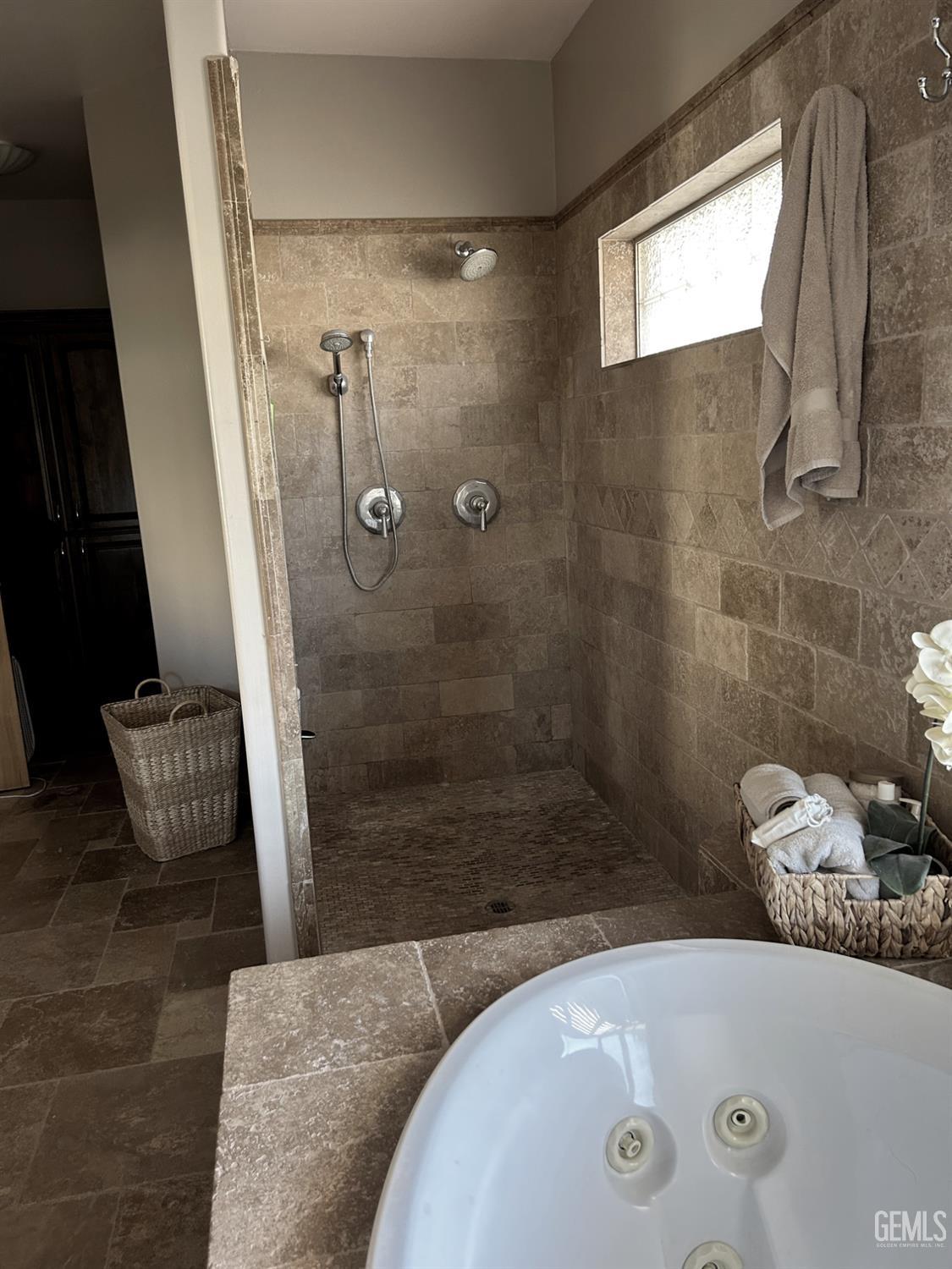 Undisclosed Address Lake Isabella, CA 93240 - Photo 25 of 40 a bathroom with a granite countertop bathtub shower and vanity