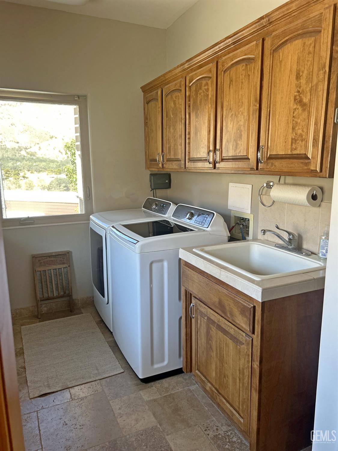 Undisclosed Address Lake Isabella, CA 93240 - Photo 28 of 40 a utility room with sink dryer and washer