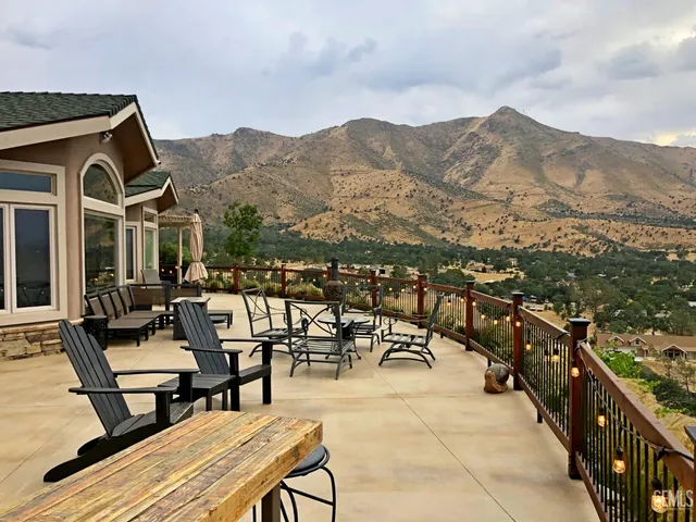 a view of a terrace with couches and sky view