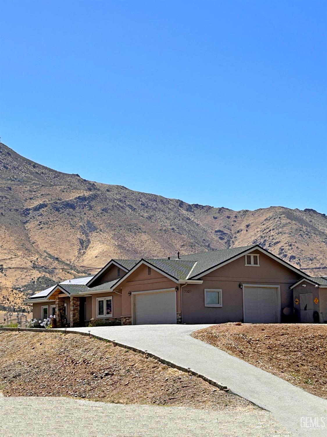Undisclosed Address Lake Isabella, CA 93240 - Photo 4 of 40 a view of a big house with a big yard and large trees