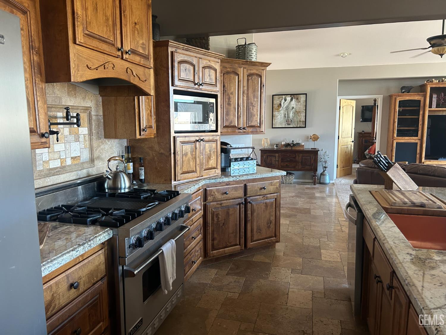Undisclosed Address Lake Isabella, CA 93240 - Photo 9 of 40 a kitchen with stainless steel appliances granite countertop a stove top oven a sink dishwasher and cabinets with wooden floor