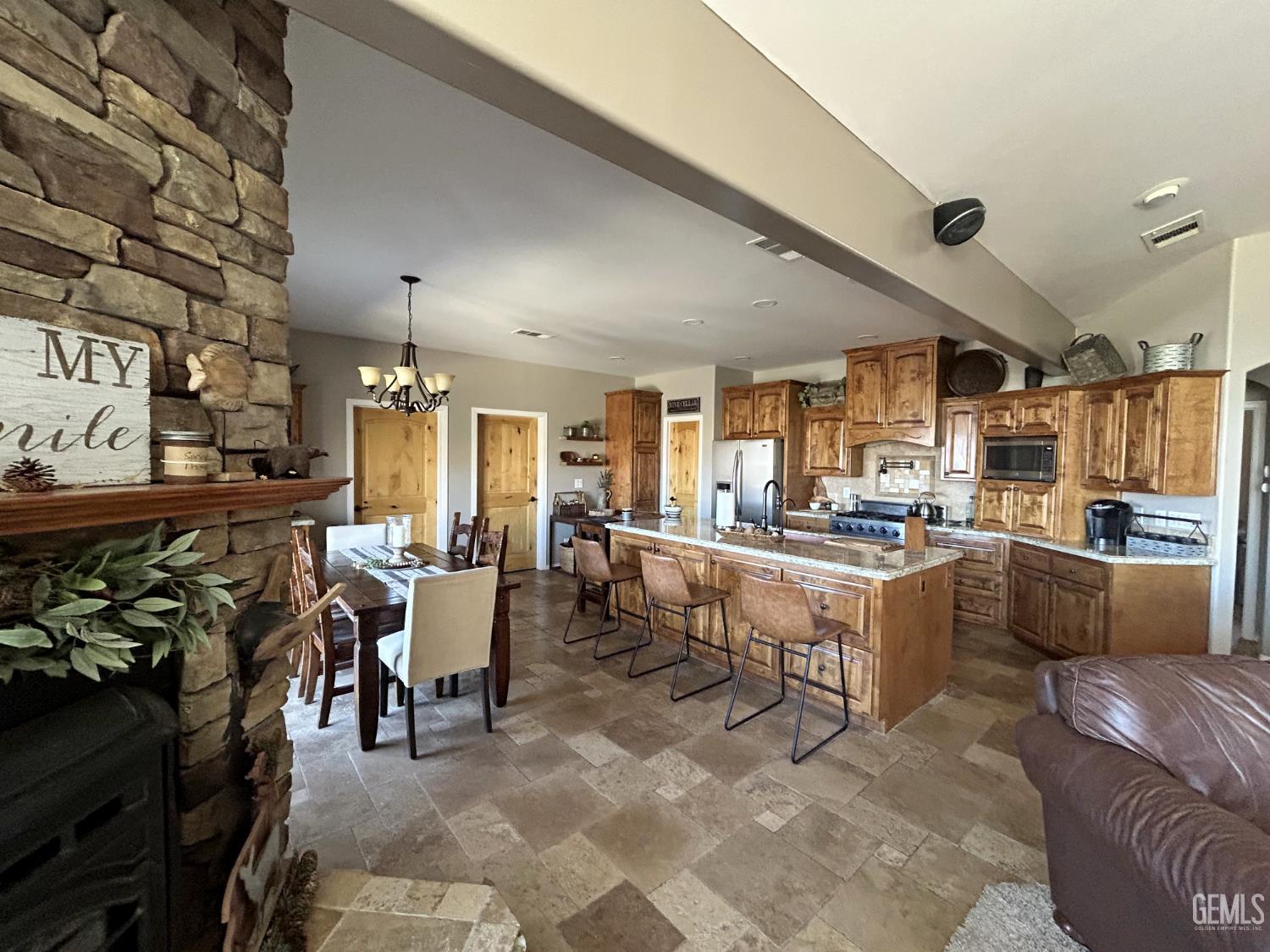 Undisclosed Address Lake Isabella, CA 93240 - Photo 10 of 40 a large room with lots of tables a flat screen tv and couches