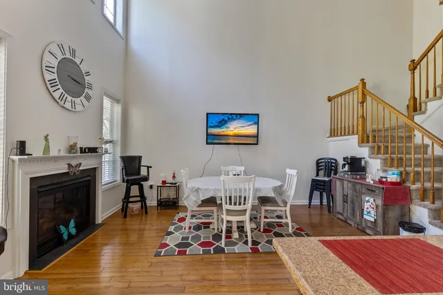 a living room with furniture a rug and a fireplace