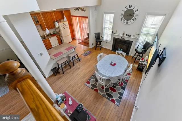 a view of living room with furniture and a fireplace