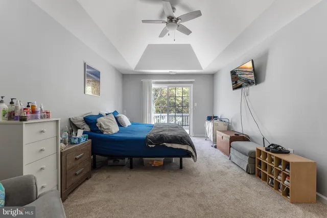 a bed room with furniture and a window
