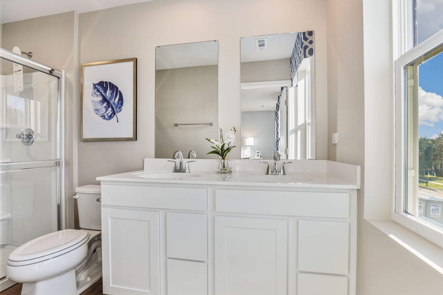 1725 Sunglow Lane DeKalb, IL 60115 - Photo 12 of 20 a bathroom with a sink a toilet and a mirror