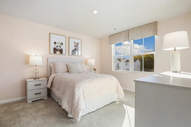 a spacious bedroom with a bed and a large mirror