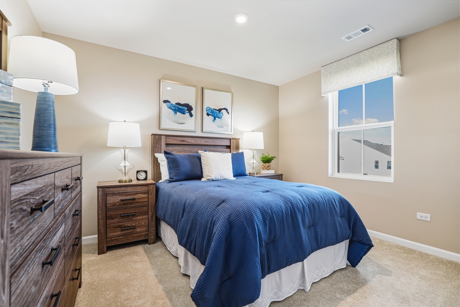 1725 Sunglow Lane DeKalb, IL 60115 - Photo 15 of 20 a bedroom with a bed and a lamp on table