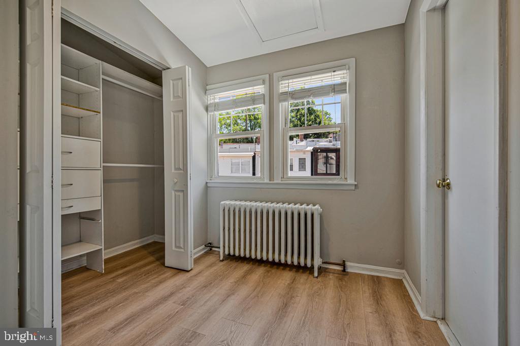 2406 37th Street Northwest Washington, DC 20007 - Photo 6 of 44 a view of a room with wooden floor and windows