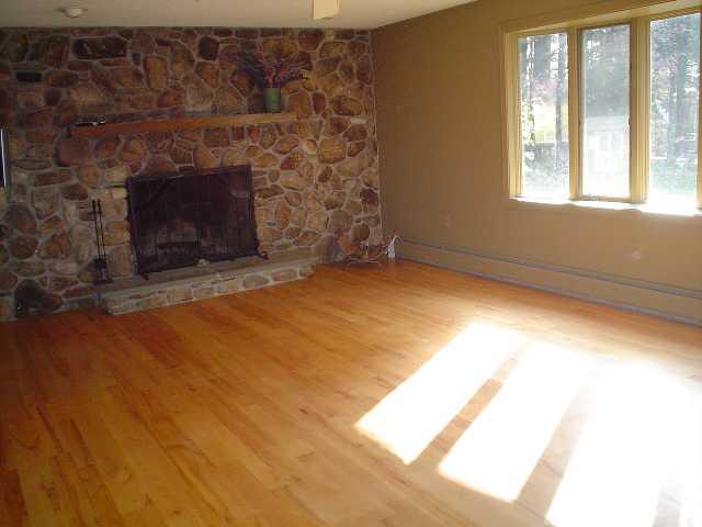 28 Old Hitchcock Road Great Barrington, MA 01230 - Photo 14 of 18 Sunny living room with stone fireplace