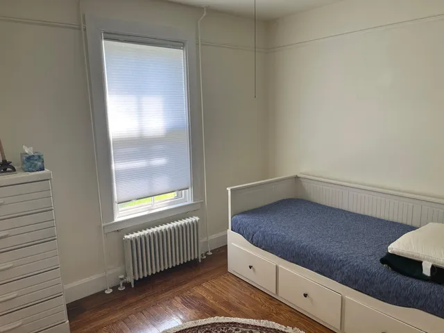 a kitchen with granite countertop white cabinets and sink