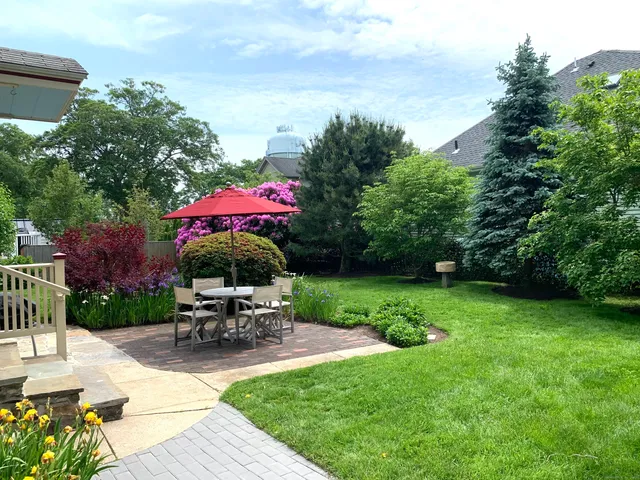 a view of a backyard with sitting area