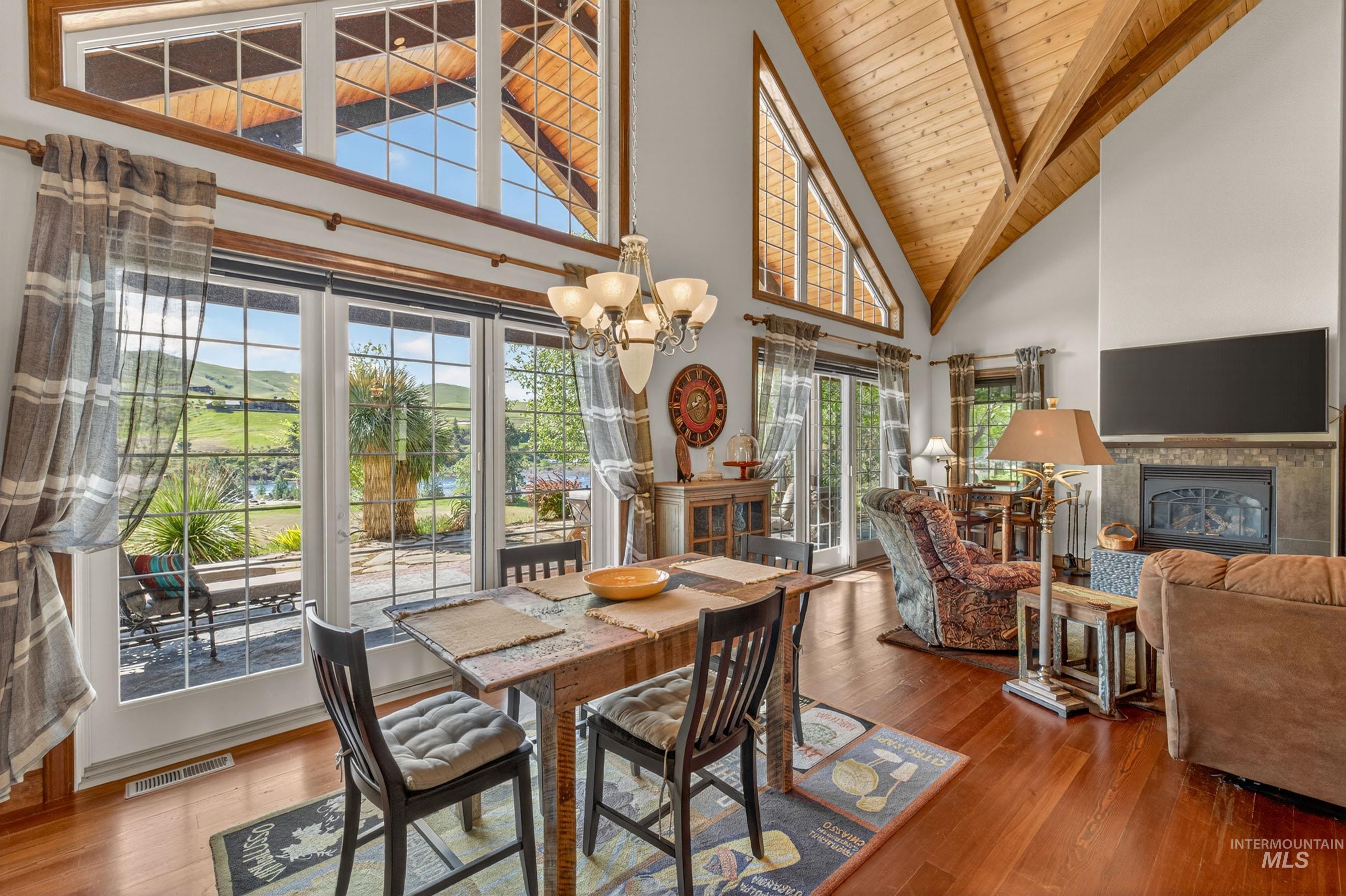 113 Deford Road White Bird, ID 83554 - Photo 14 of 49 Vaulted wood-plank ceilings with exposed beams complement the wood-finish flooring