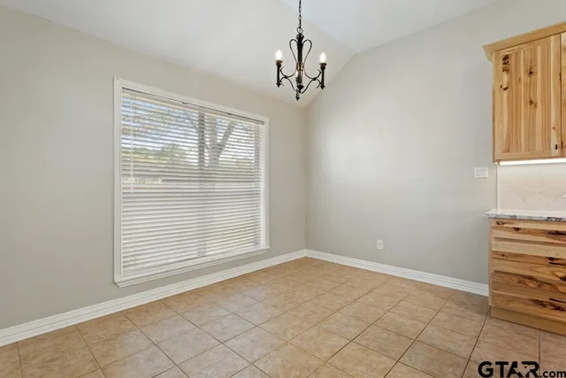 a view of empty room with windows