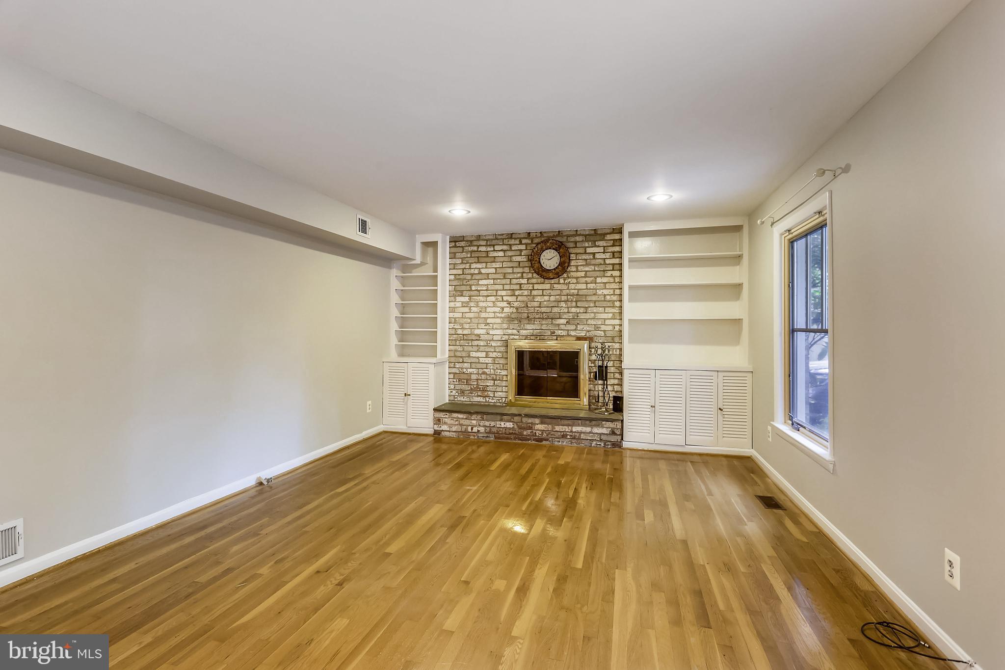 11909 Seven Locks Road Potomac, MD 20854 - Photo 10 of 43 Cozy family room with wood burning FP