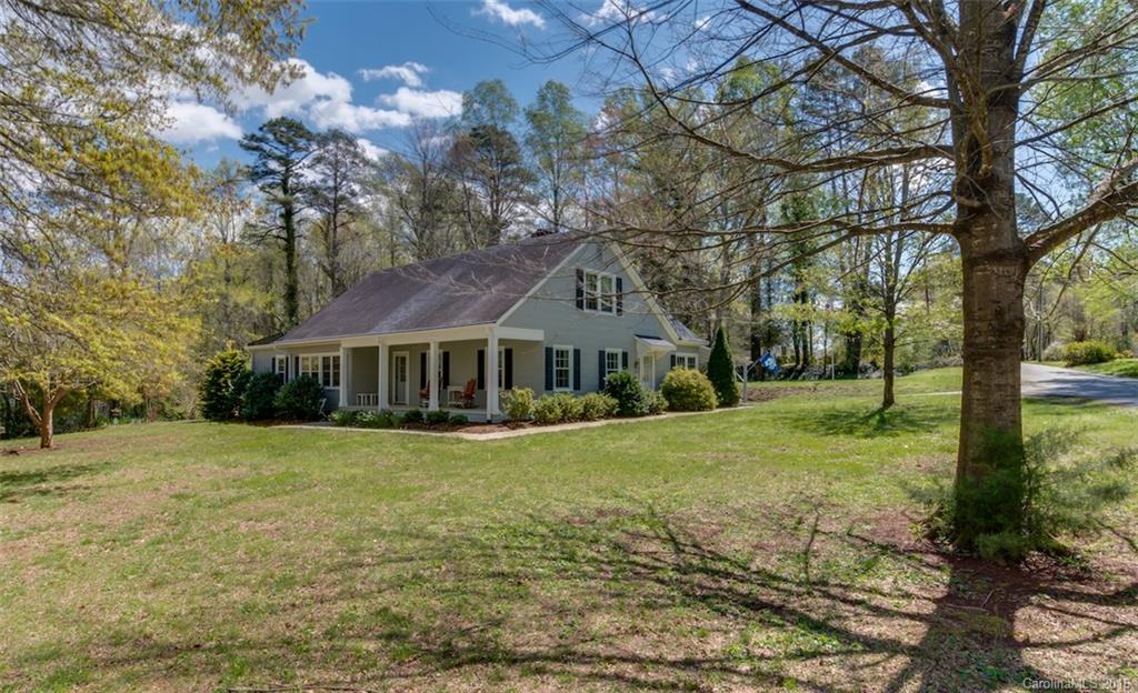 194 Harris Street Rutherfordton, NC 28139 - Photo 1 of 24 a view of a big house with a big yard and large trees