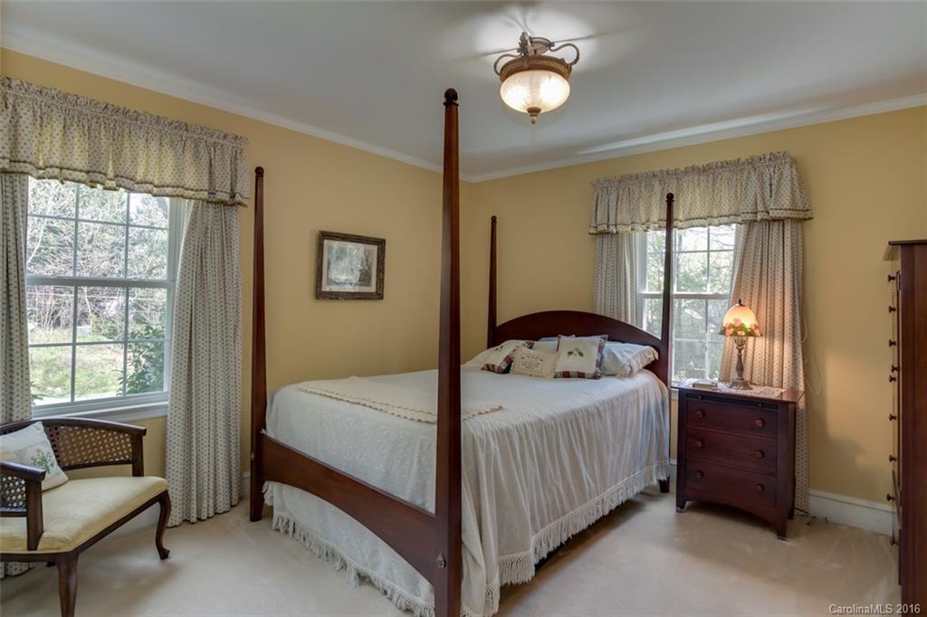 194 Harris Street Rutherfordton, NC 28139 - Photo 13 of 24 a bedroom with a bed and a couch