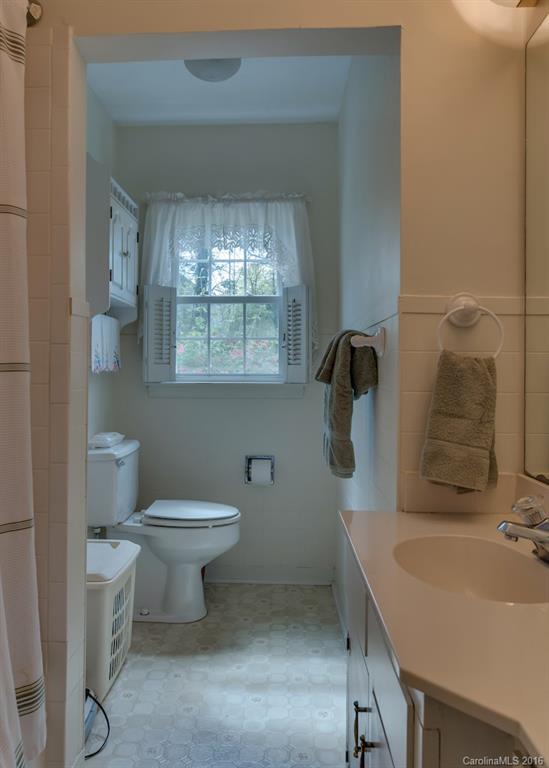 194 Harris Street Rutherfordton, NC 28139 - Photo 15 of 24 a bathroom with a sink toilet and shower