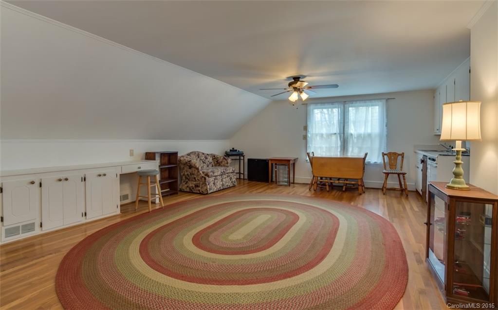194 Harris Street Rutherfordton, NC 28139 - Photo 18 of 24 a room with furniture and a chandelier