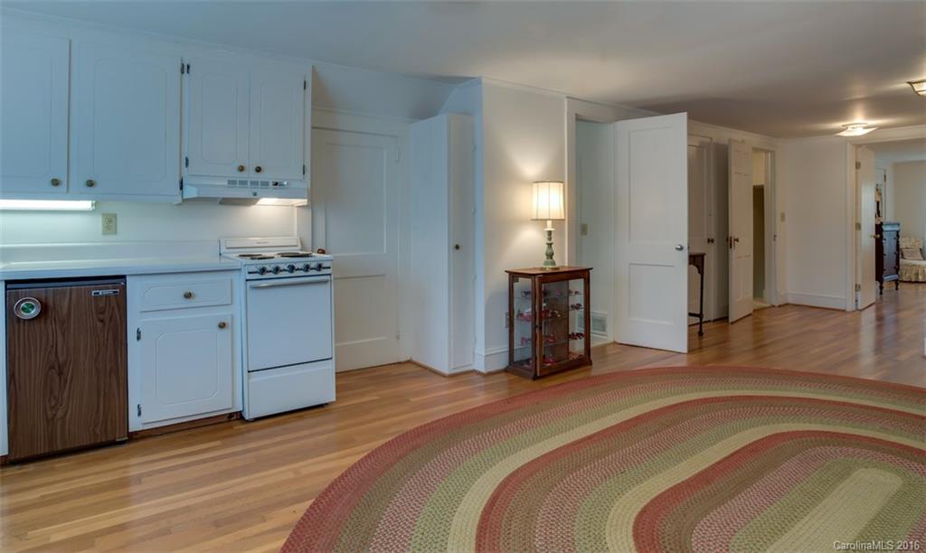 194 Harris Street Rutherfordton, NC 28139 - Photo 19 of 24 a spacious bedroom with a bed and cabinets