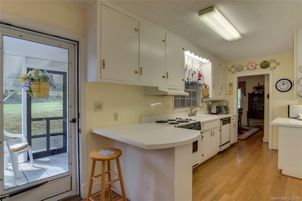 194 Harris Street Rutherfordton, NC 28139 - Photo 5 of 24 a kitchen with a sink stove and cabinets
